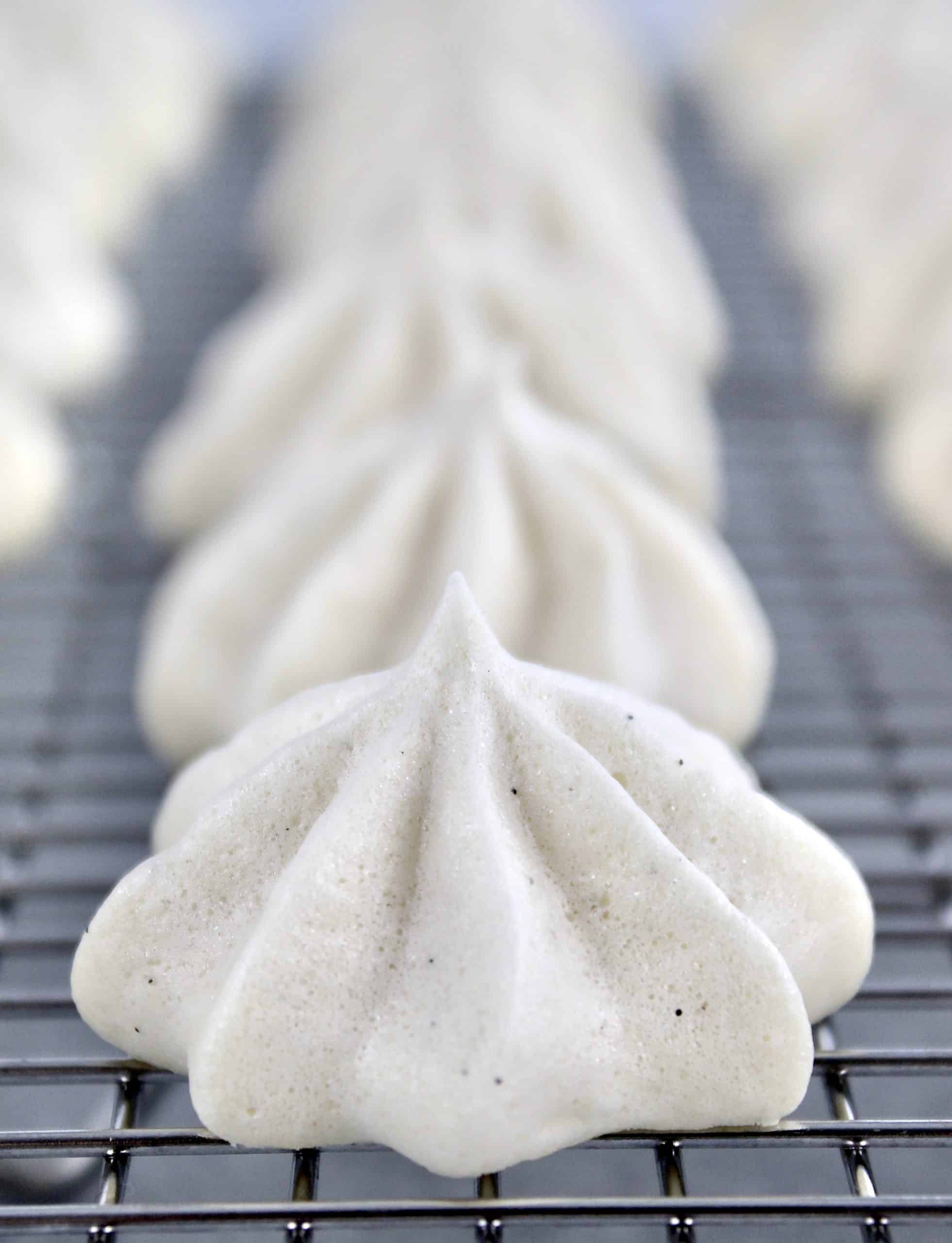 closeup of meringues on cooling rack