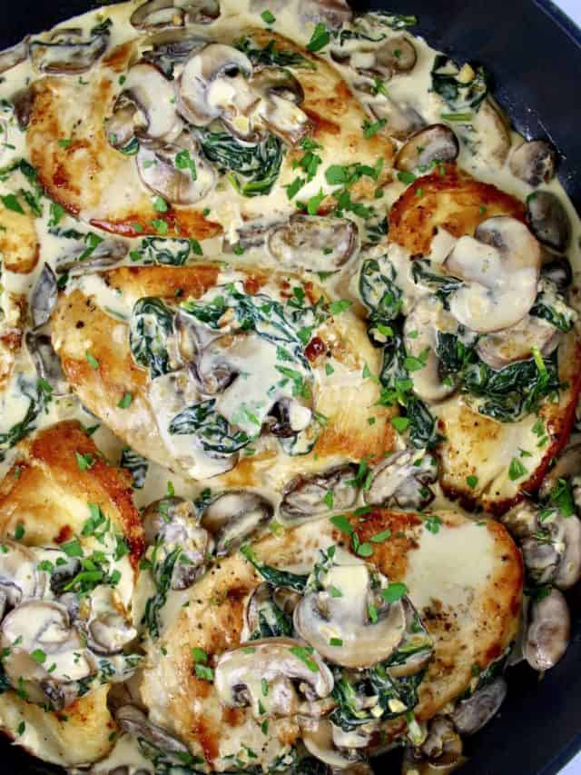 Chicken Florentine in skillet with mushrooms and spinach on top