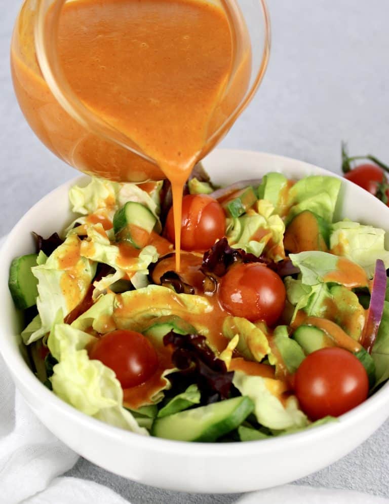 Keto Catalina Dressing being poured over salad