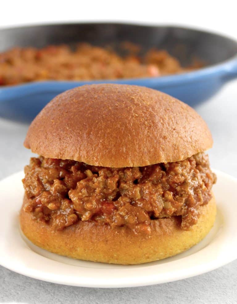 Keto Sloppy Joe on white plate with blue skillet in background