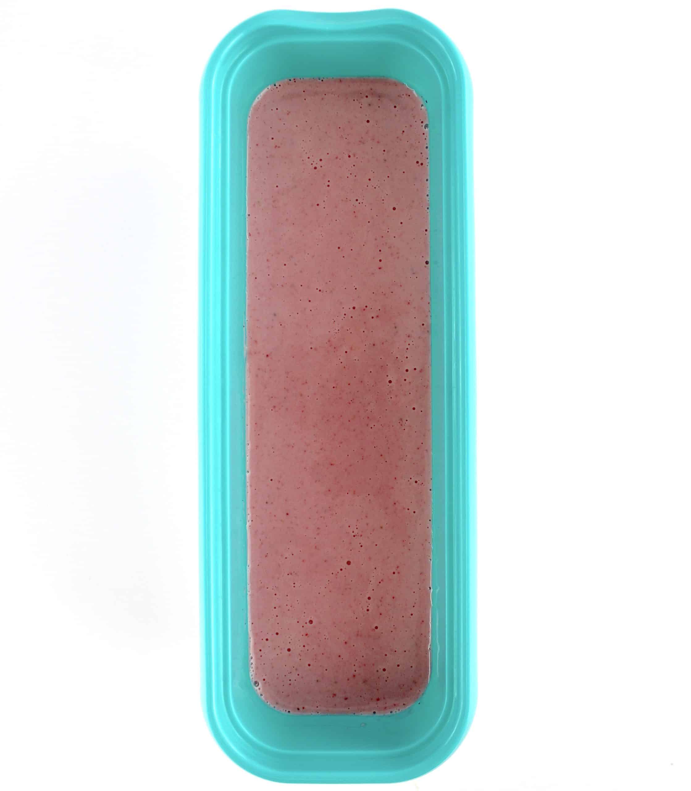 Keto Strawberry Frozen Yogurt in open teal ice cream container