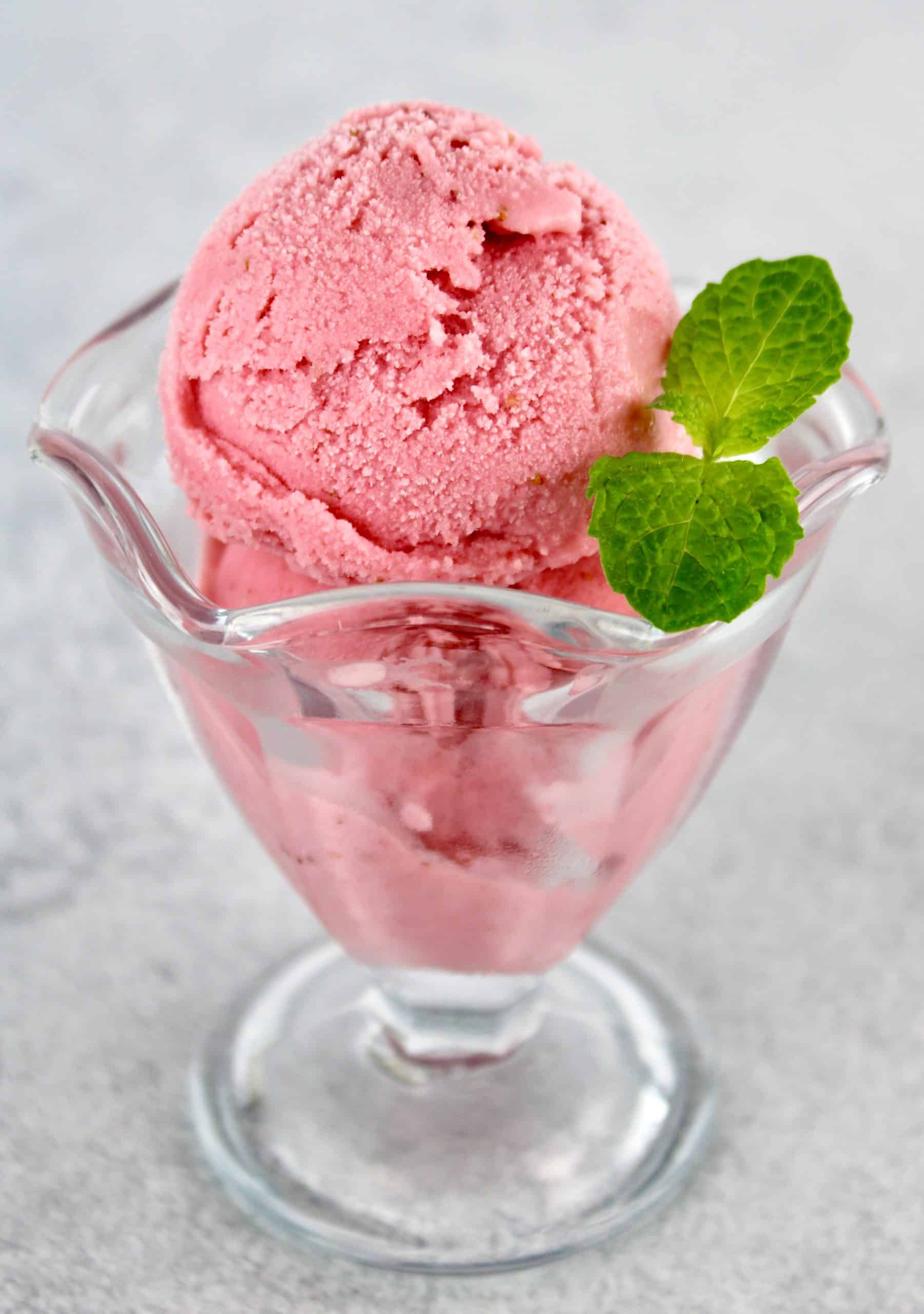 Keto Strawberry Frozen Yogurt in glass with mint sprig