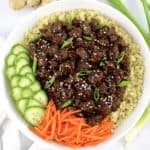 Korean Beef Bowl with cauliflower rice shredded carrots and sliced cucumbers