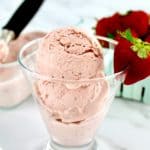 No Churn Keto Strawberry Ice Cream in glass with strawberry on side