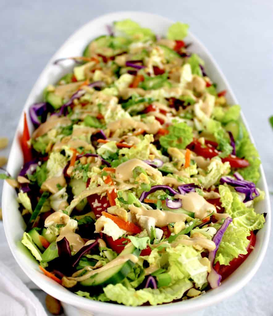 closeup of Thai Crunch Salad with Peanut Dressing in white bowl