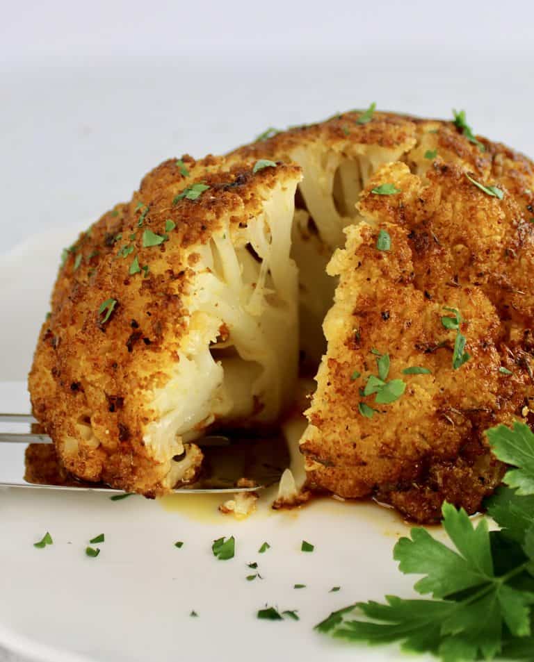 Whole Roasted Cauliflower with edge being taken out
