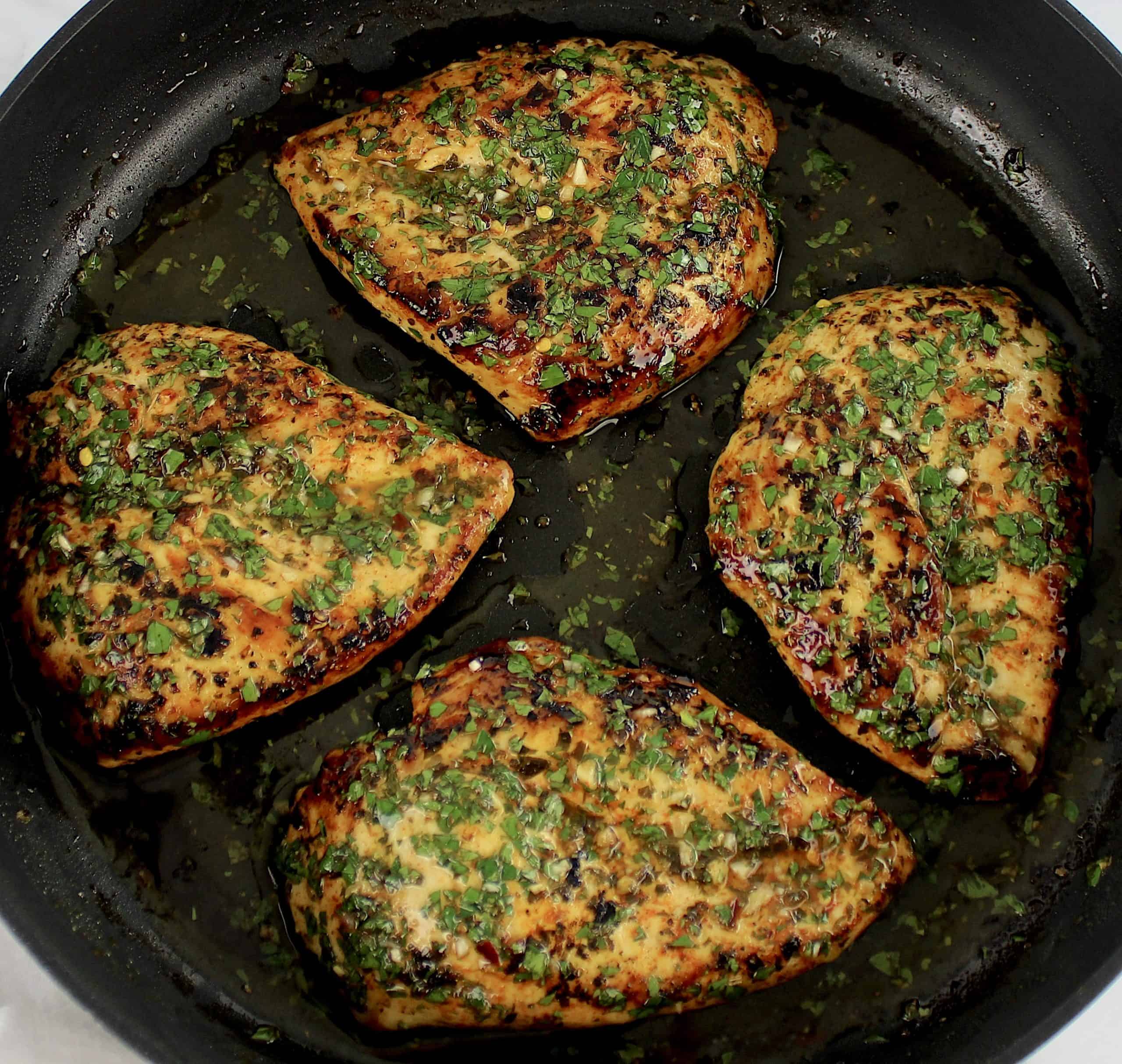 4 Chimichurri chicken breasts in skillet