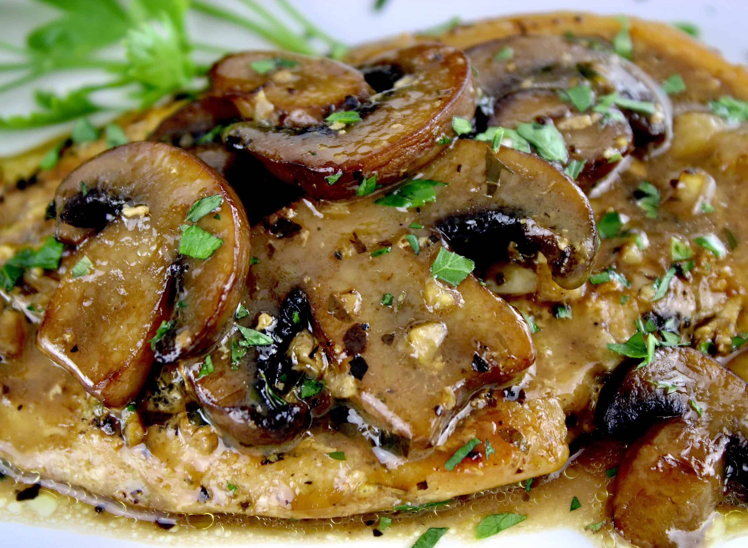 closeup of Creamy Chicken Marsala with sliced mushrooms and parsley on top