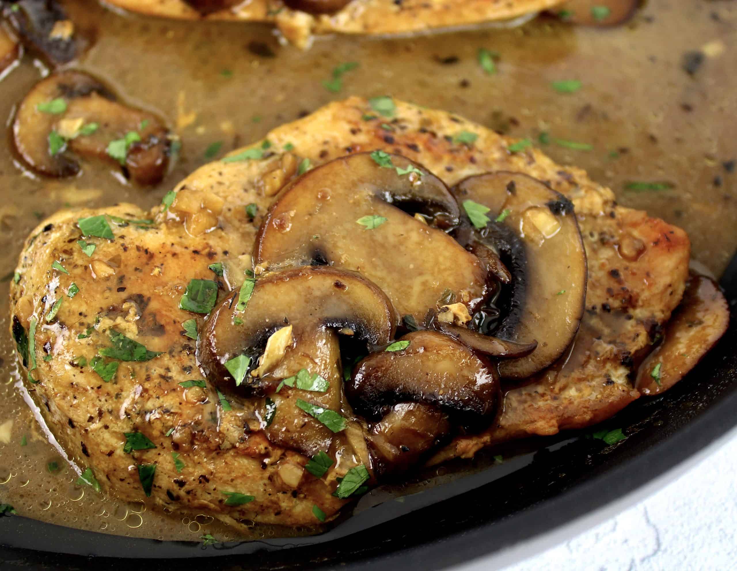 closeup of Creamy Chicken Marsala with sliced mushrooms and parsley on top