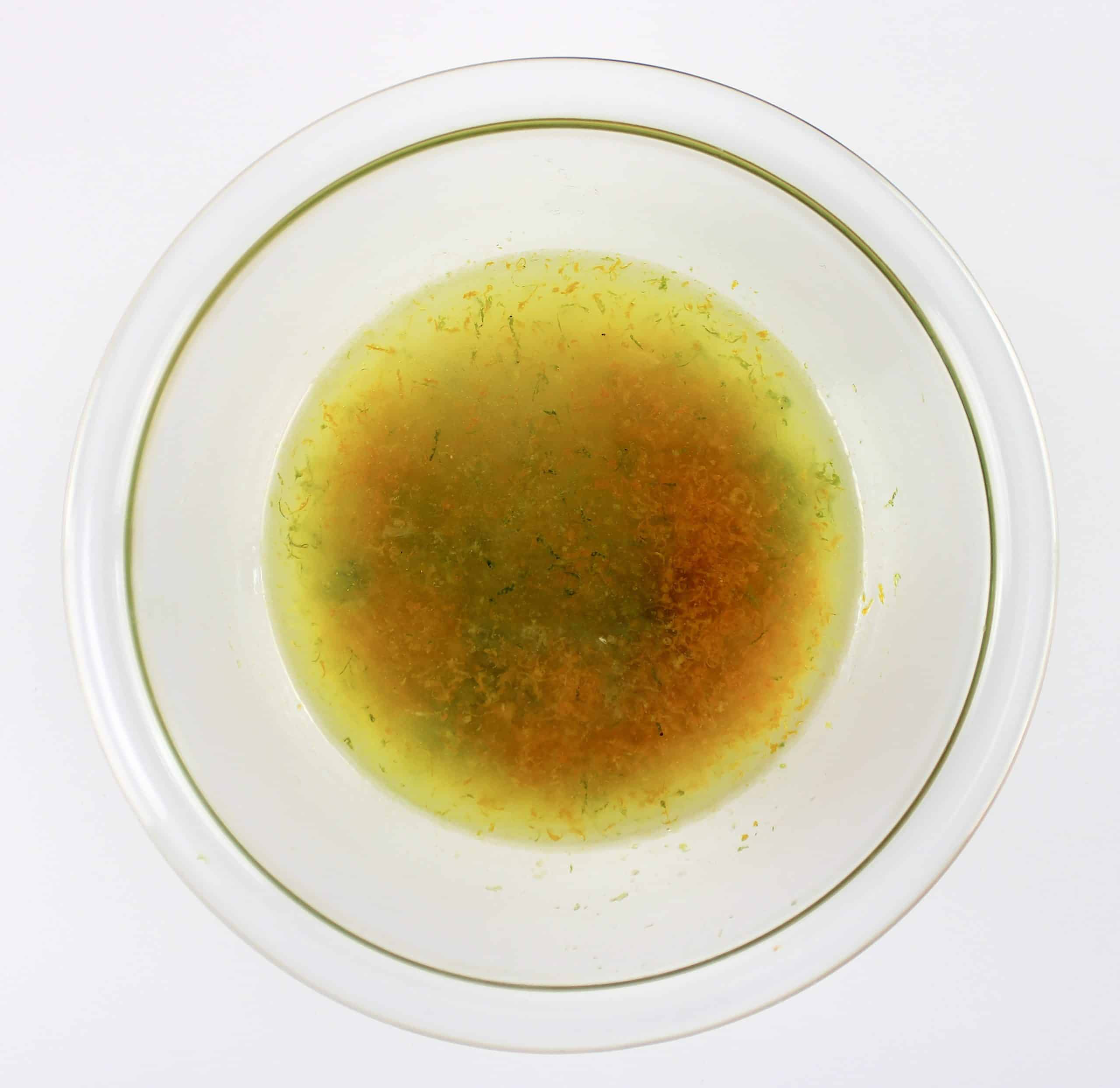 lime lemon and orange juice and zest in glass bowl