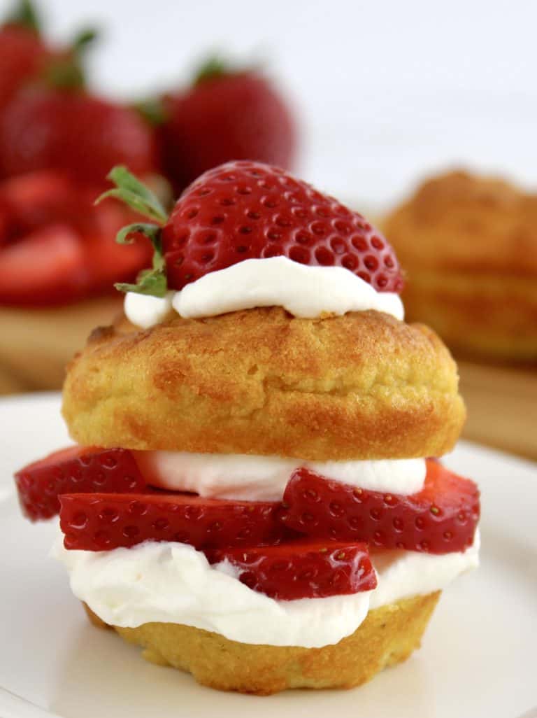 Strawberry Shortcake on white plate with half strawberry on top