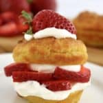 Strawberry Shortcake on white plate with half strawberry on top