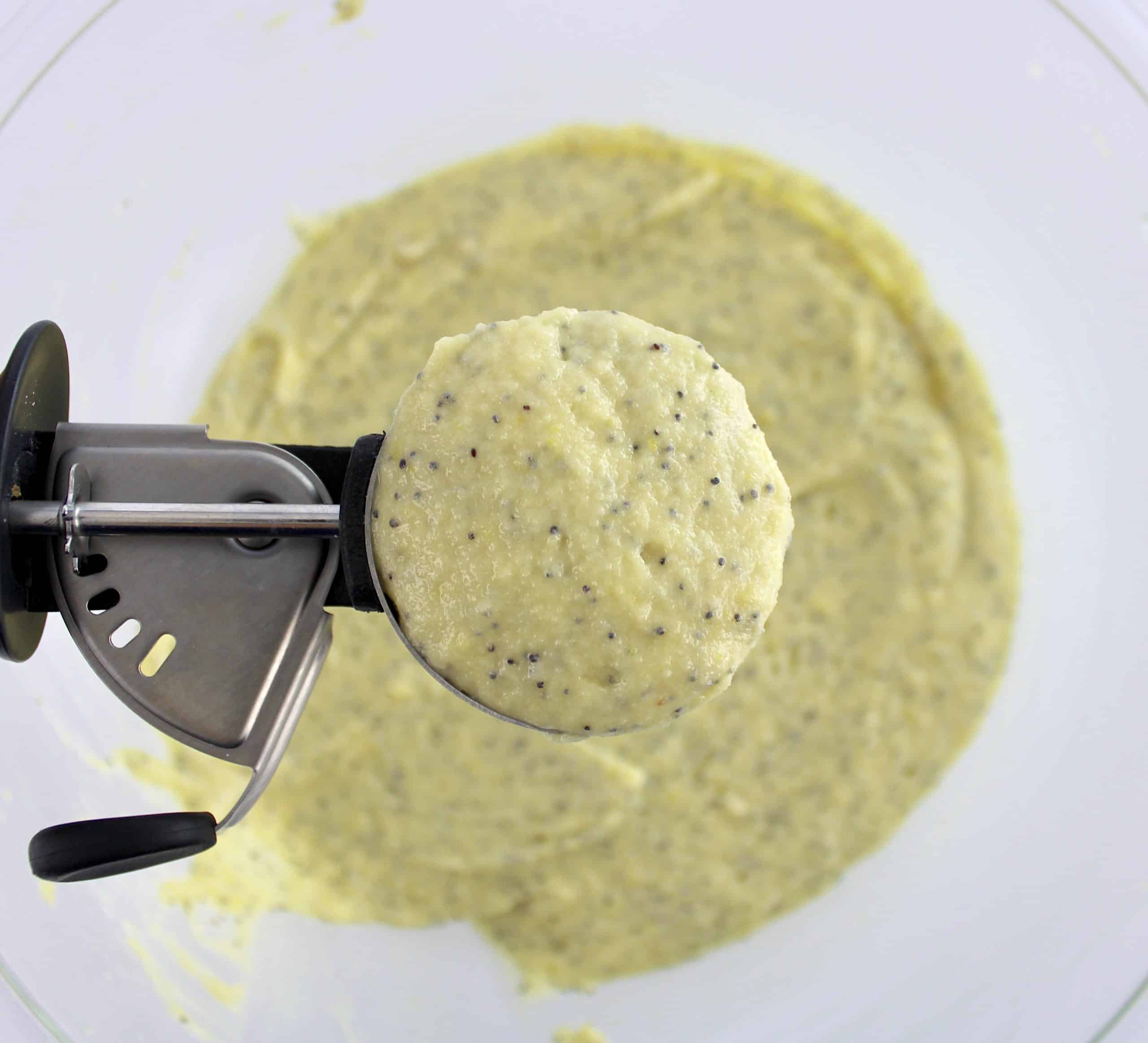Keto Lemon Poppy Seed Muffins batter being scooped in ice cream scooper