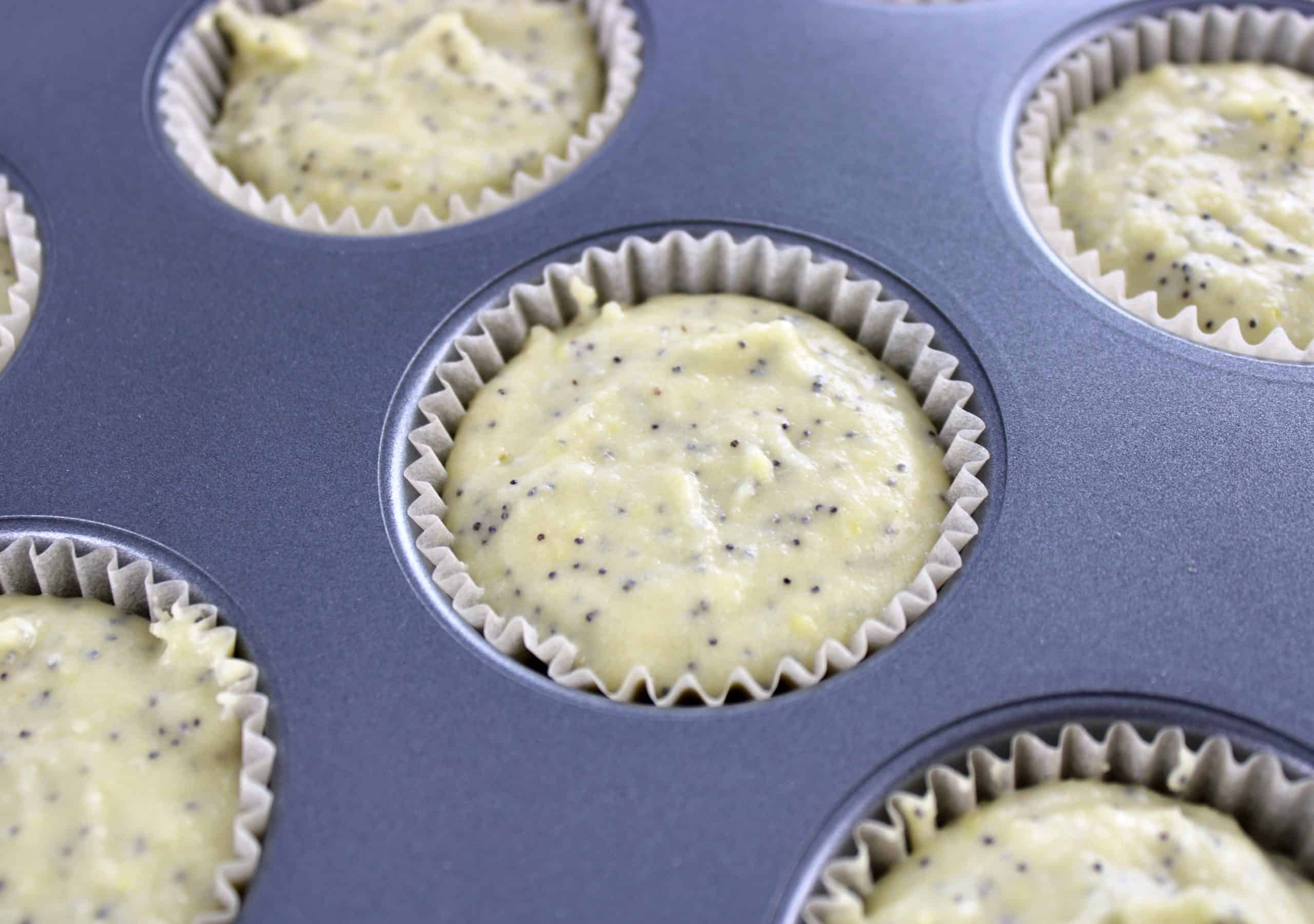 Keto Lemon Poppy Seed Muffins in muffin pan with liners unbaked