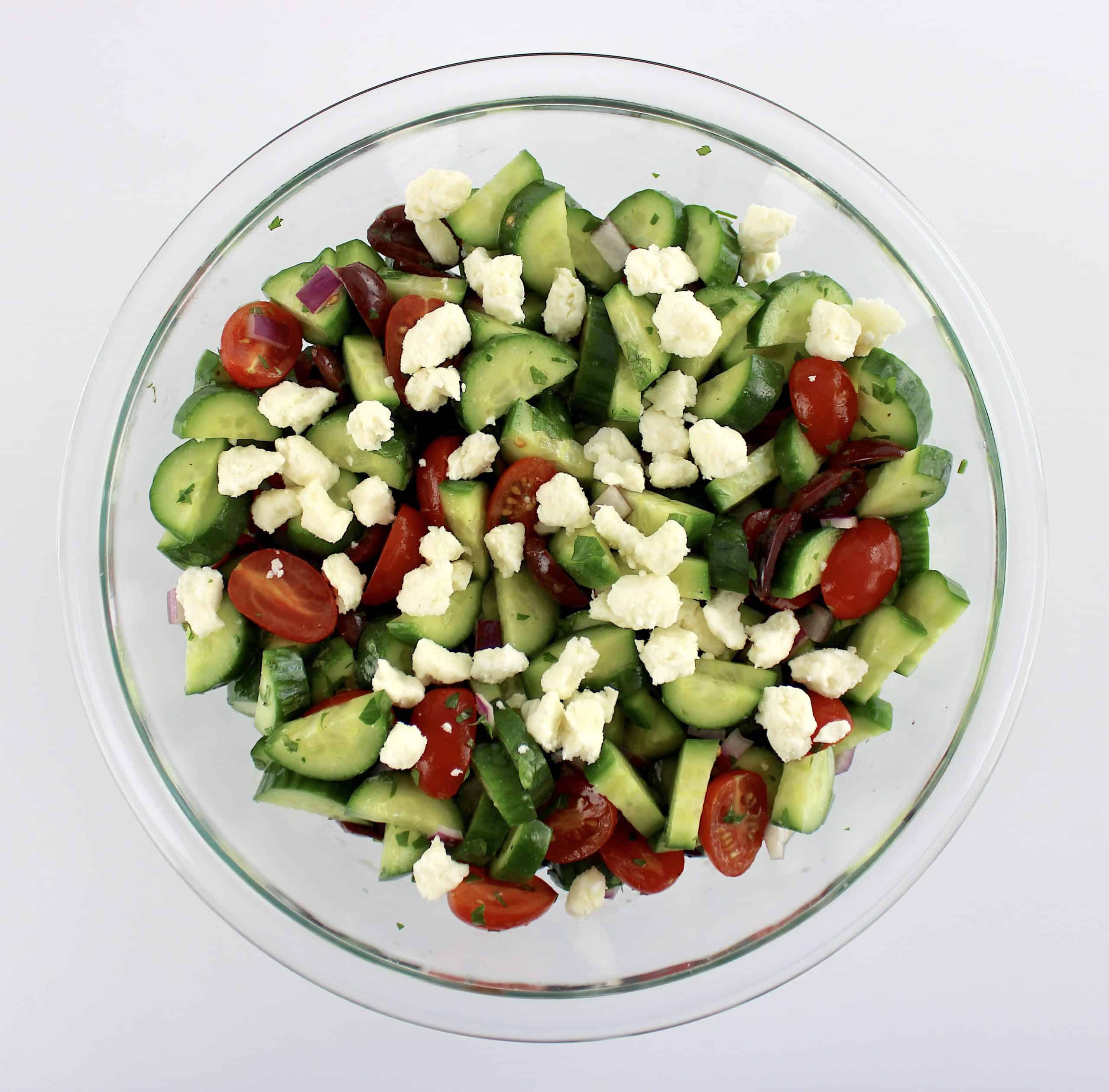 Mediterranean Cucumber Salad with feta crumbles in glass bowl