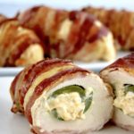 Bacon Wrapped Jalapeño Popper Chicken cut in half showing cheese filled pepper