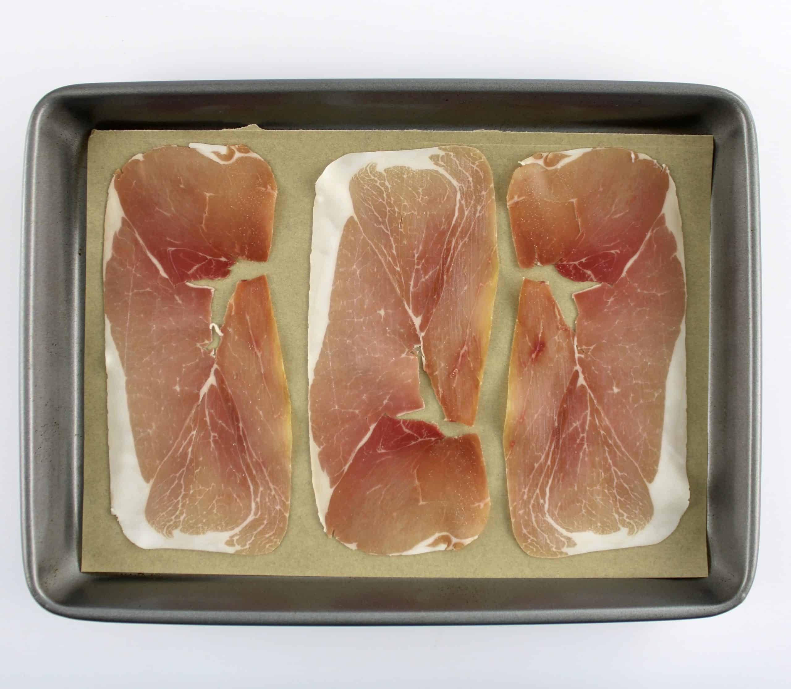 3 pieces of Prosciutto on sheetpan