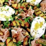 Grilled Peach Burrata Salad with Prosciutto and dressing drizzled on top