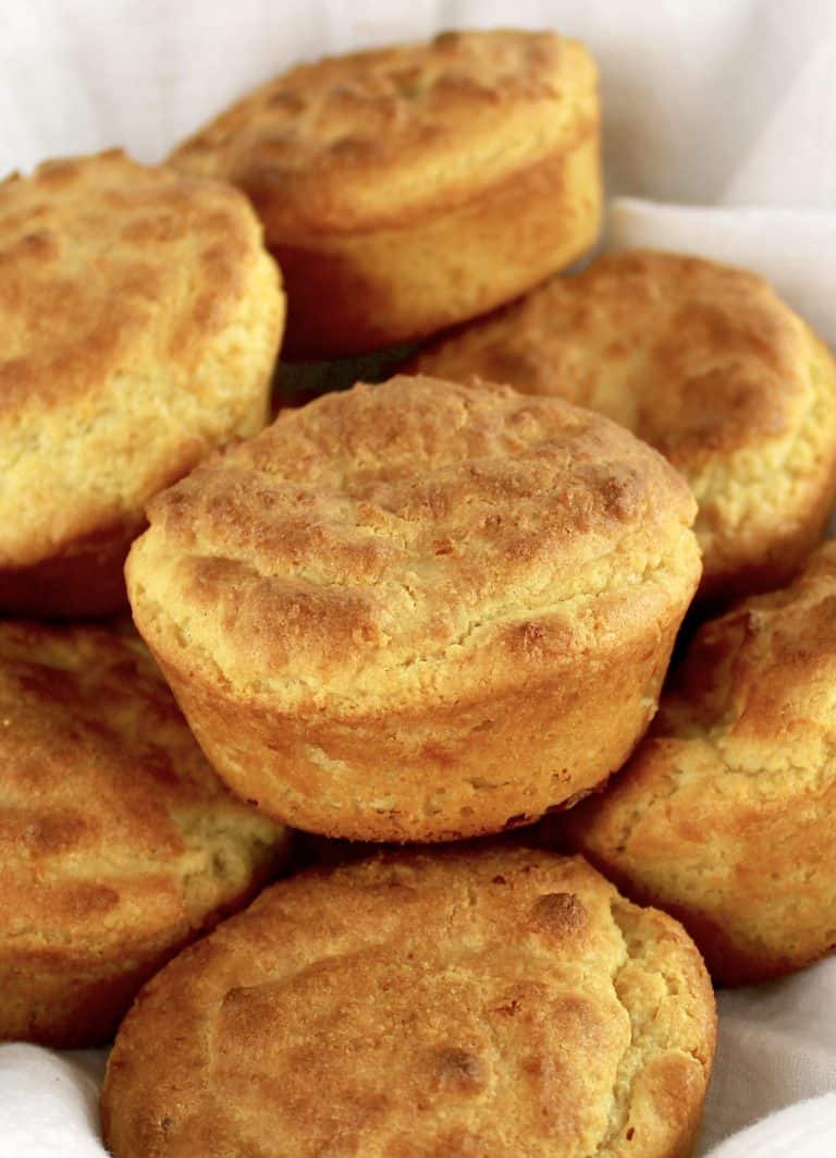 Keto Biscuits piled up in bowl with white napkin