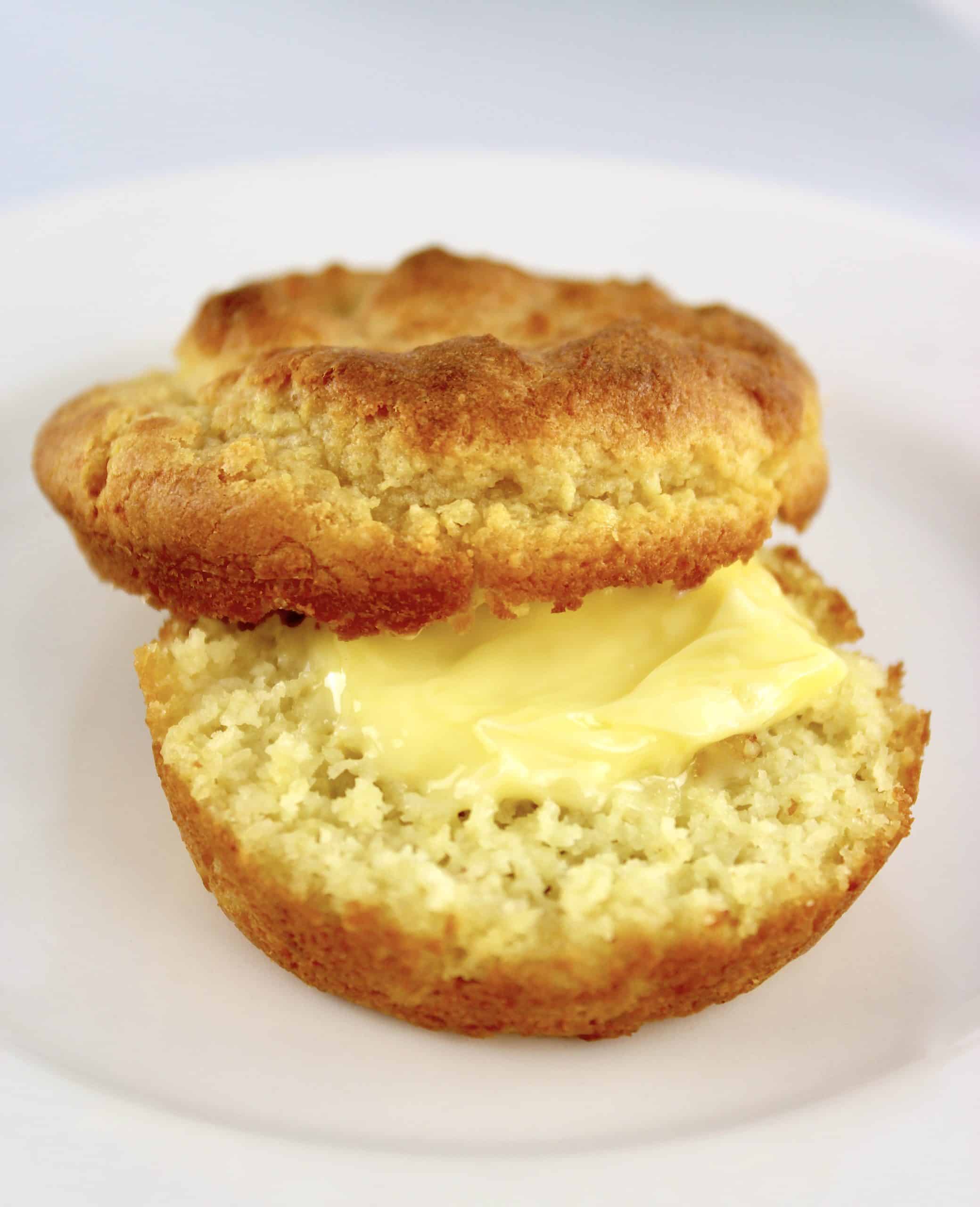 Keto Biscuit cut in half with butter on top