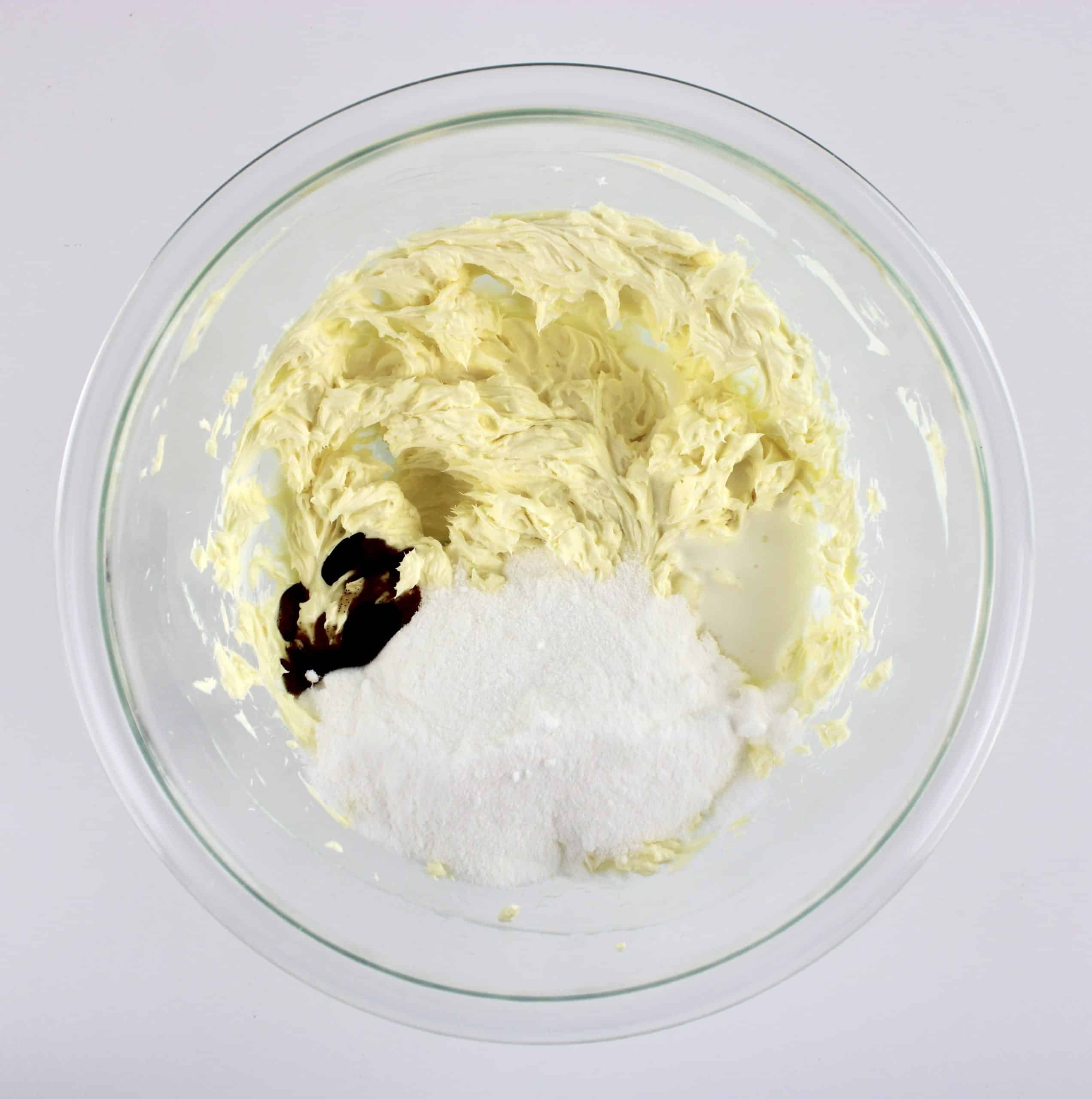 whipped butter and cream cheese with sweetener and vanilla in glass bowl