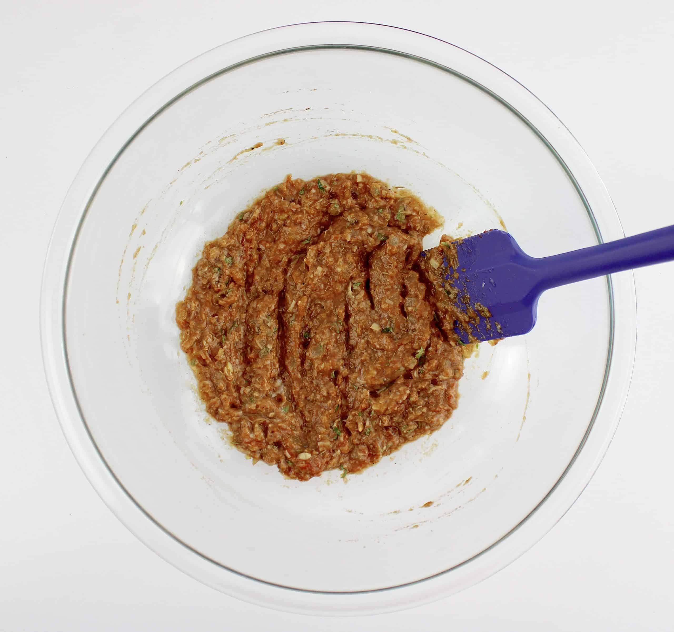 Keto Crockpot Meatloaf ingredients in glass bowl mixed