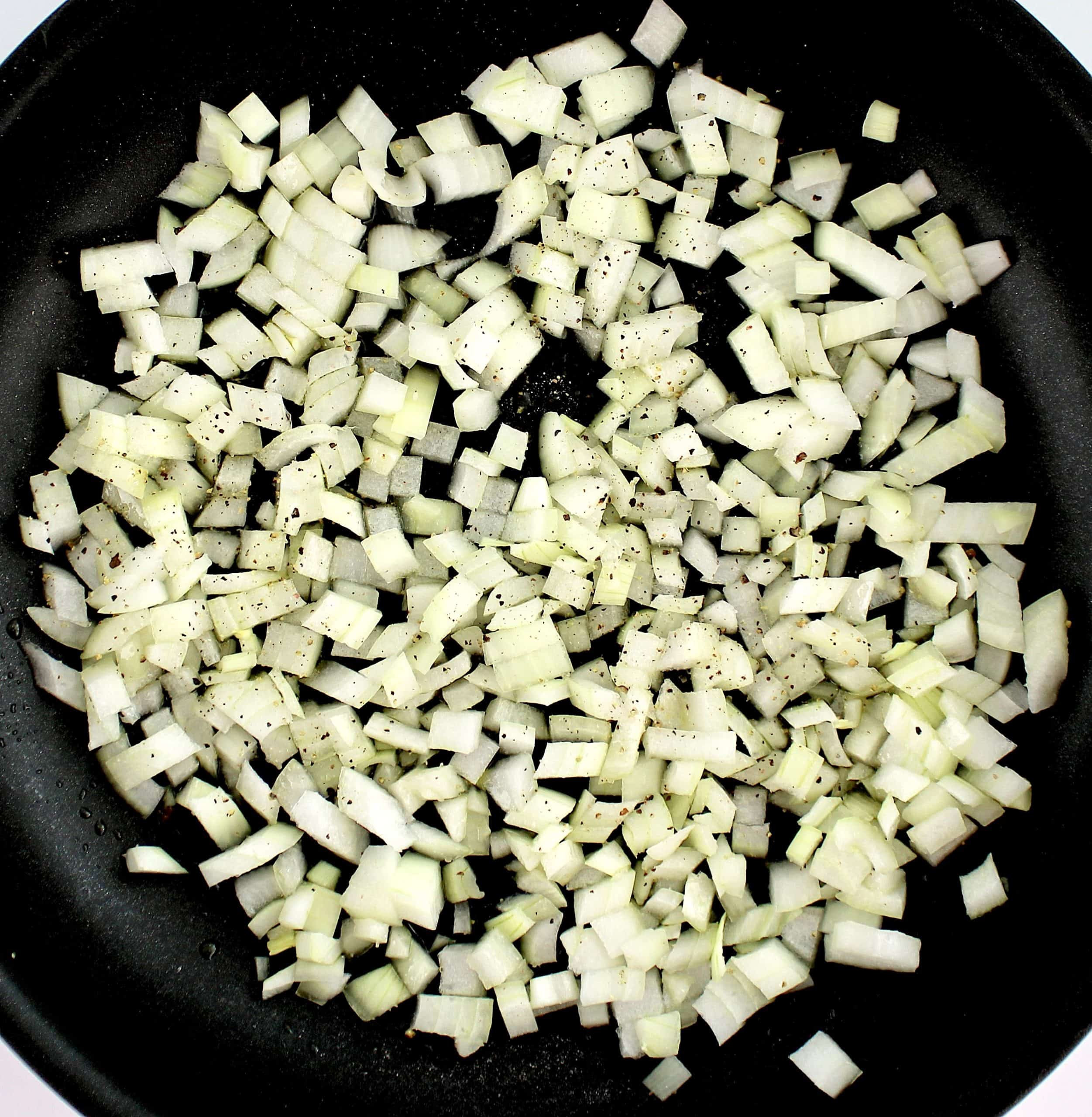 chopped onions sautéing in skillet