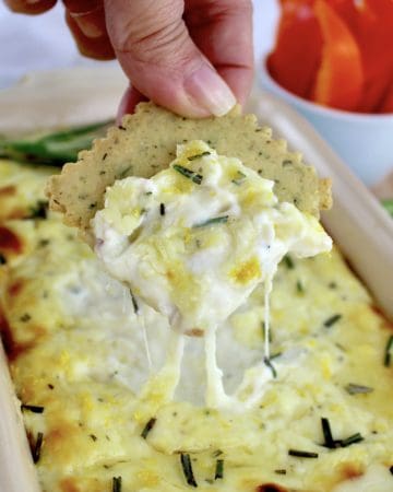 Ricotta Dip with cracker being dipped in