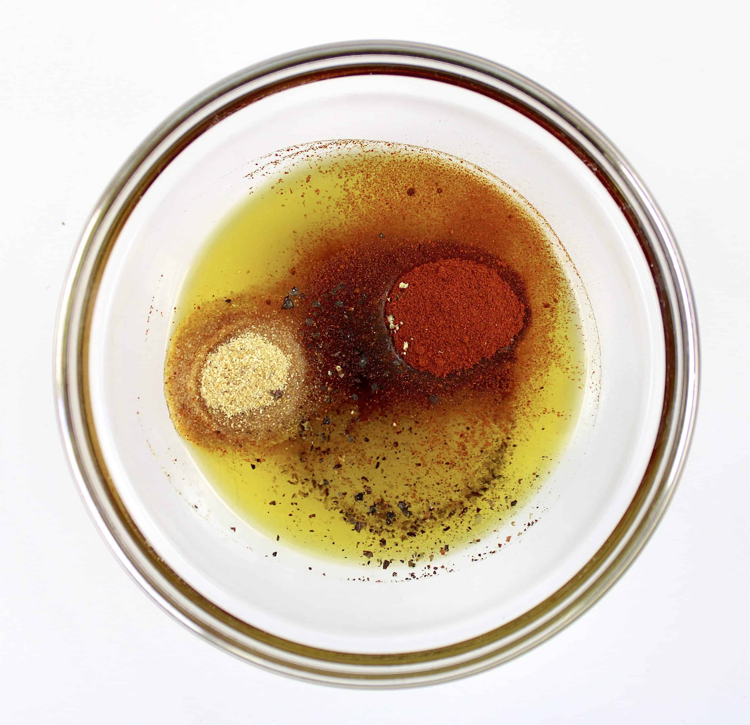 spices and olive oil in small glass bowl