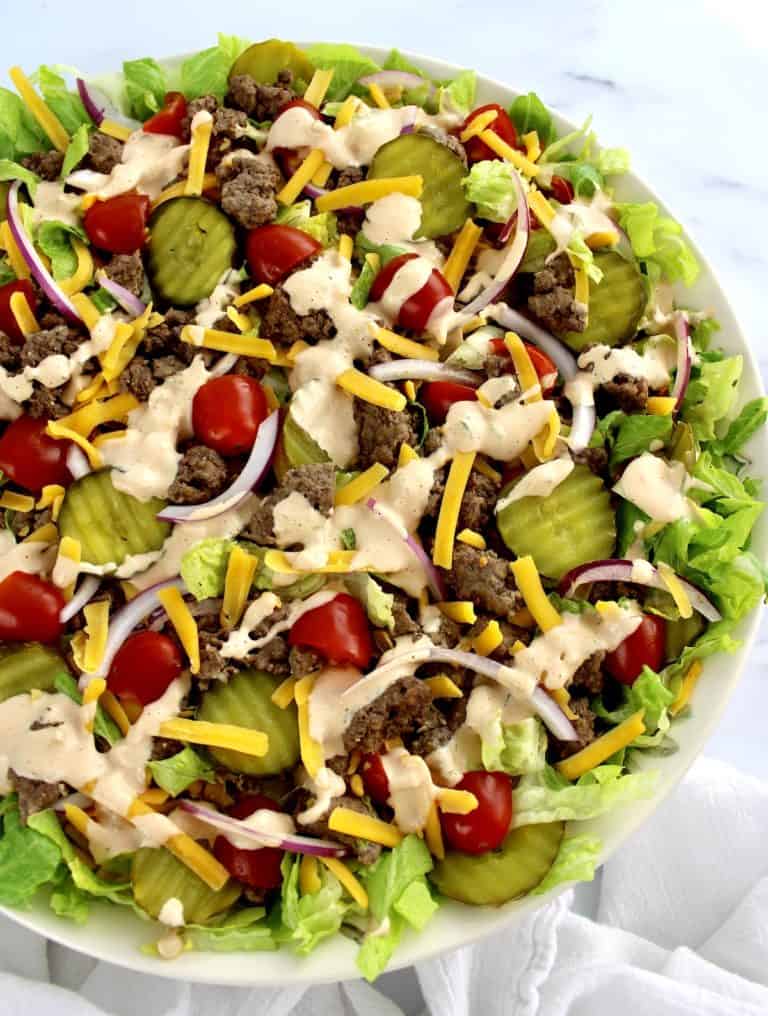 overhead view of Big Mac Cheeseburger Salad in beige bowl