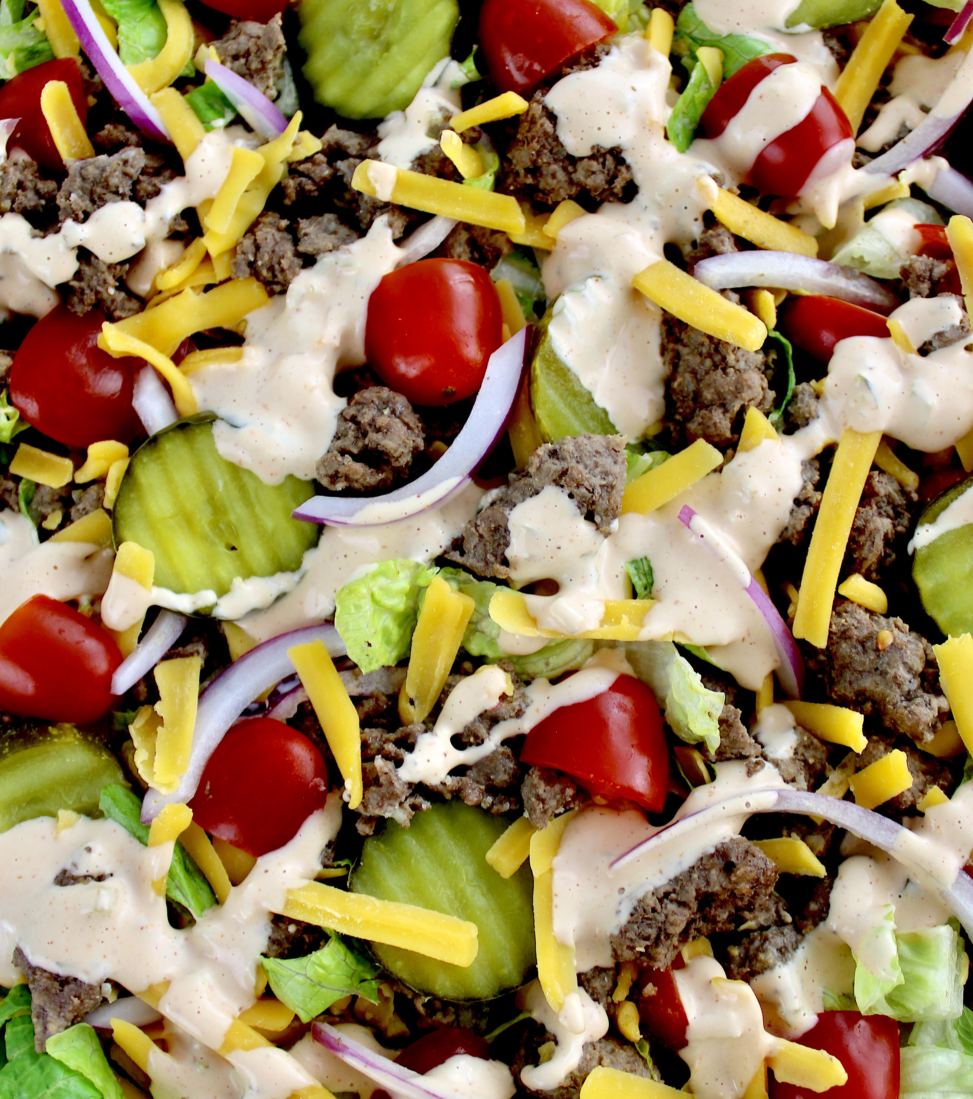 closeup of Big Mac Cheeseburger Salad with thousand island dressing