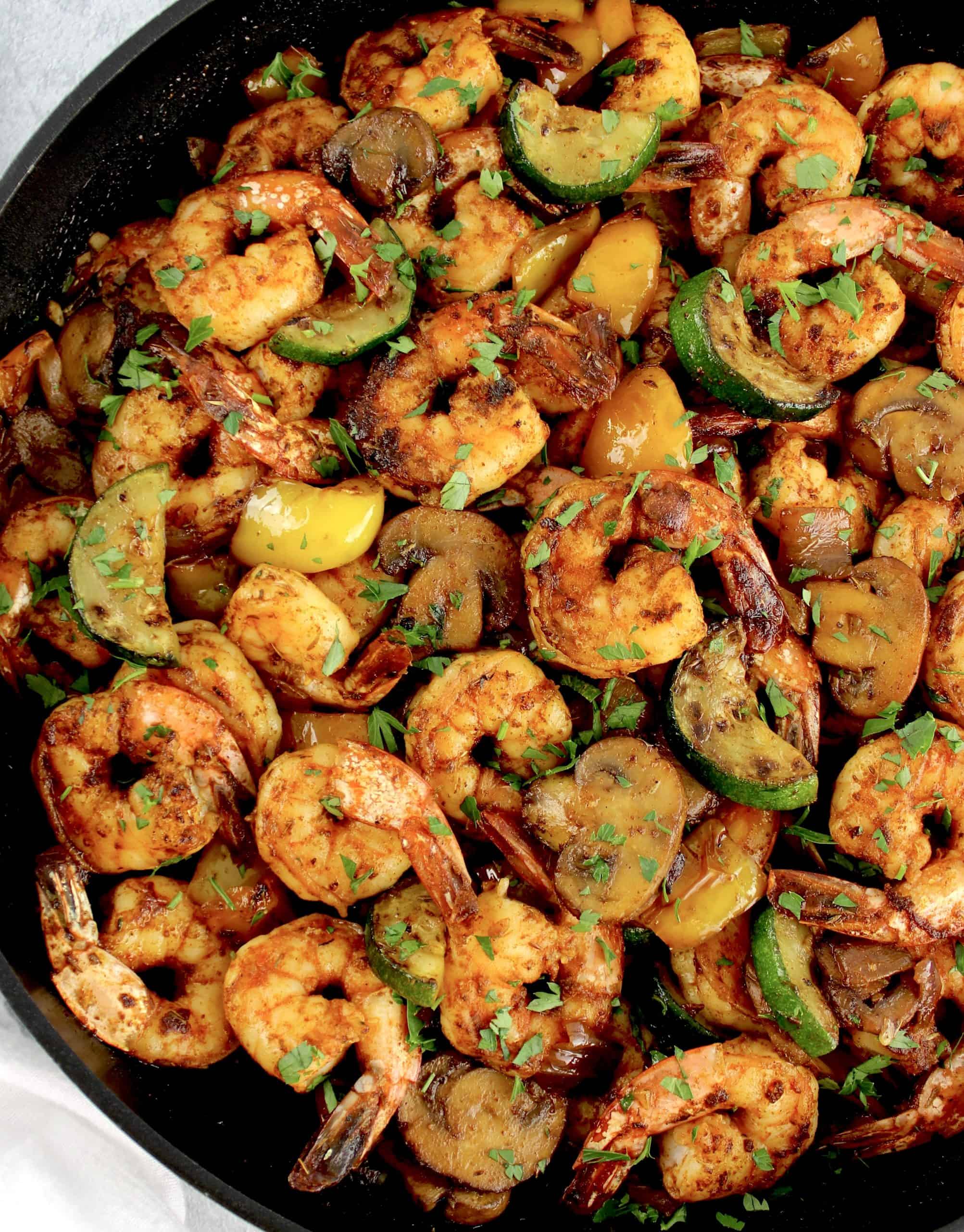 Garlic Butter Shrimp and Veggies Skillet with chopped parsley