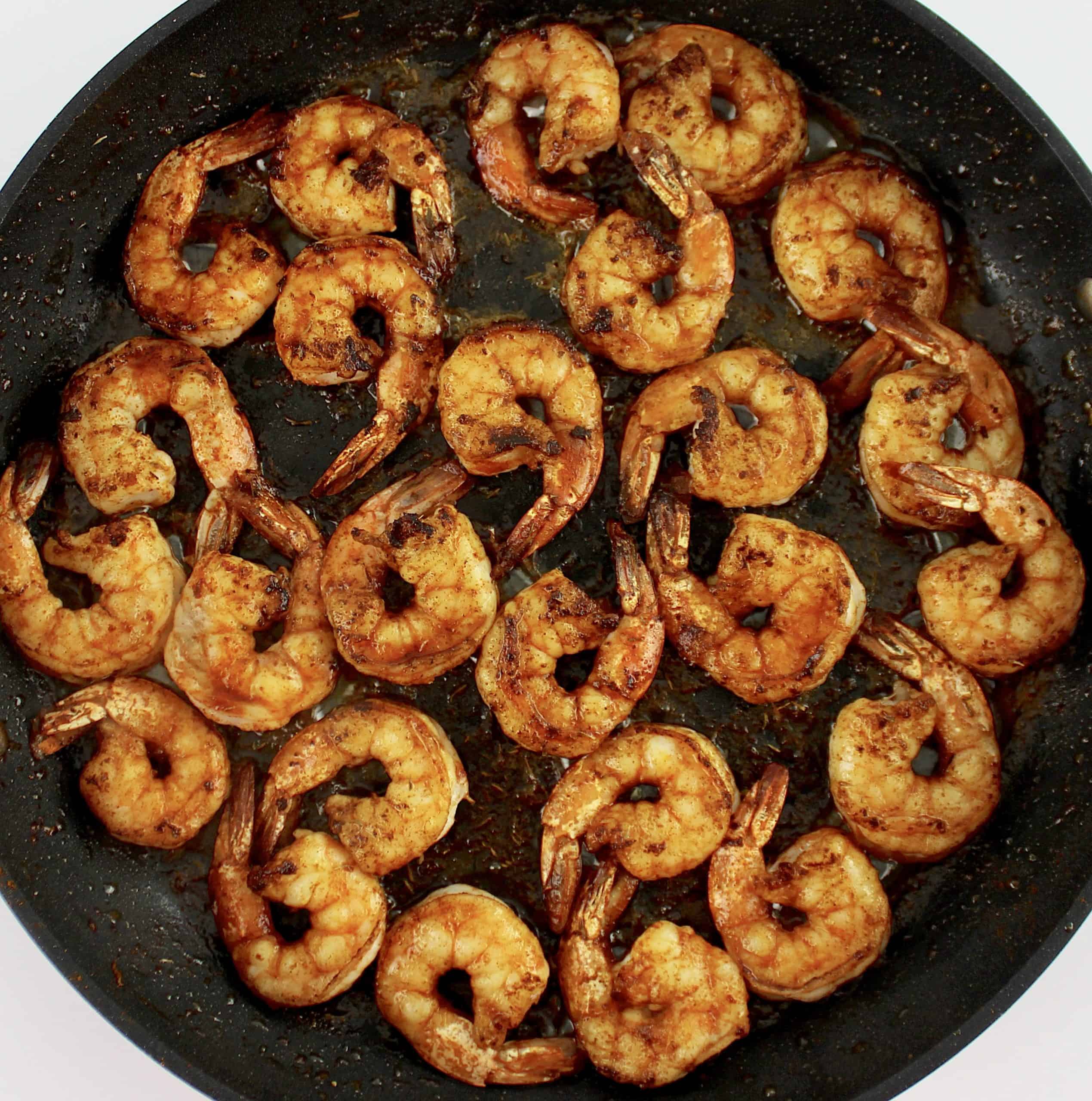 cooked shrimp with spices in skillet