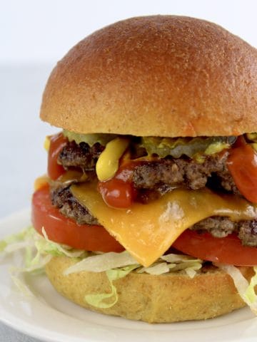 closeup of Keto Smash Burger with cheese tomatoes and lettuce