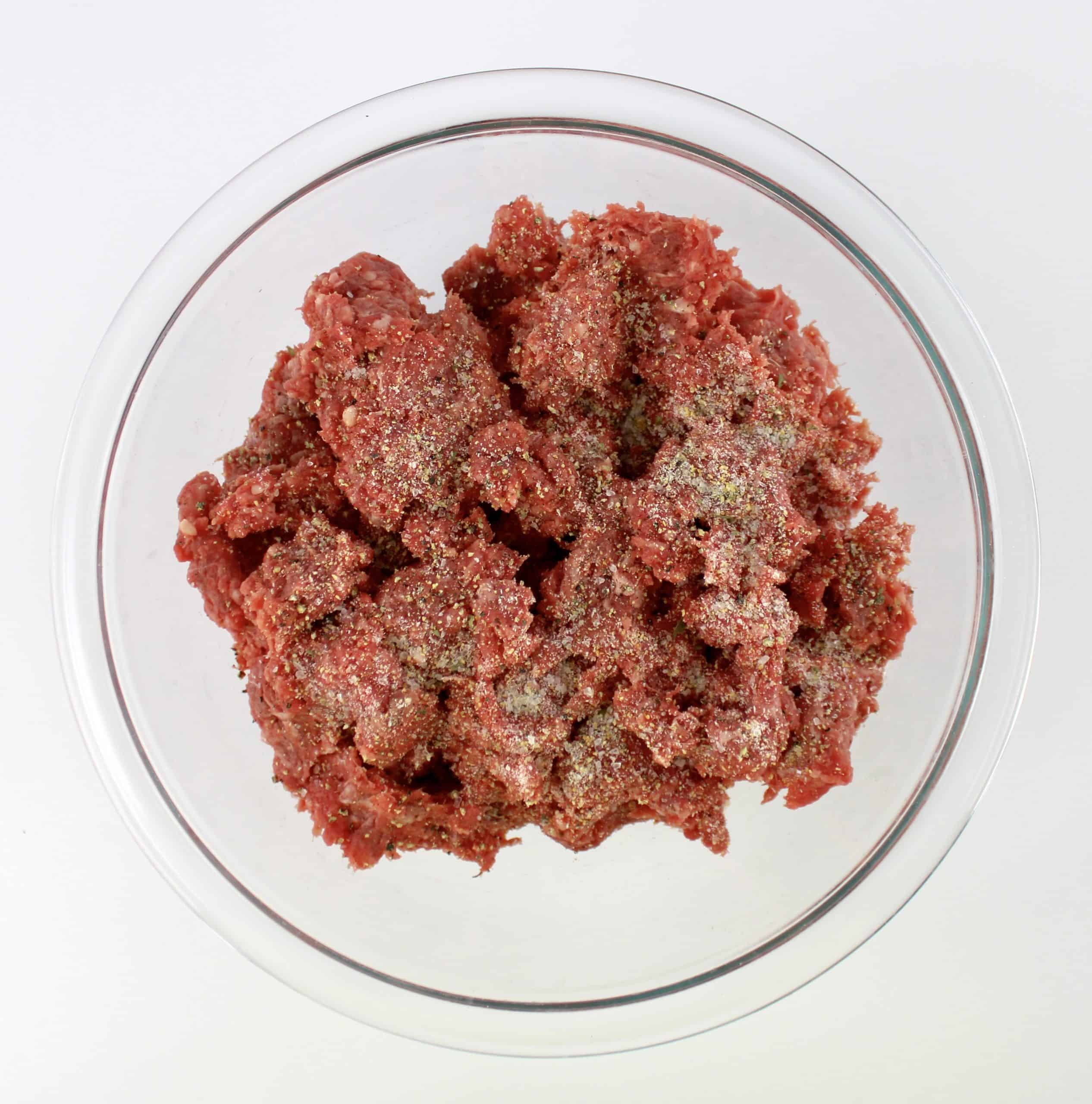 sesasoned ground beef in glass bowl