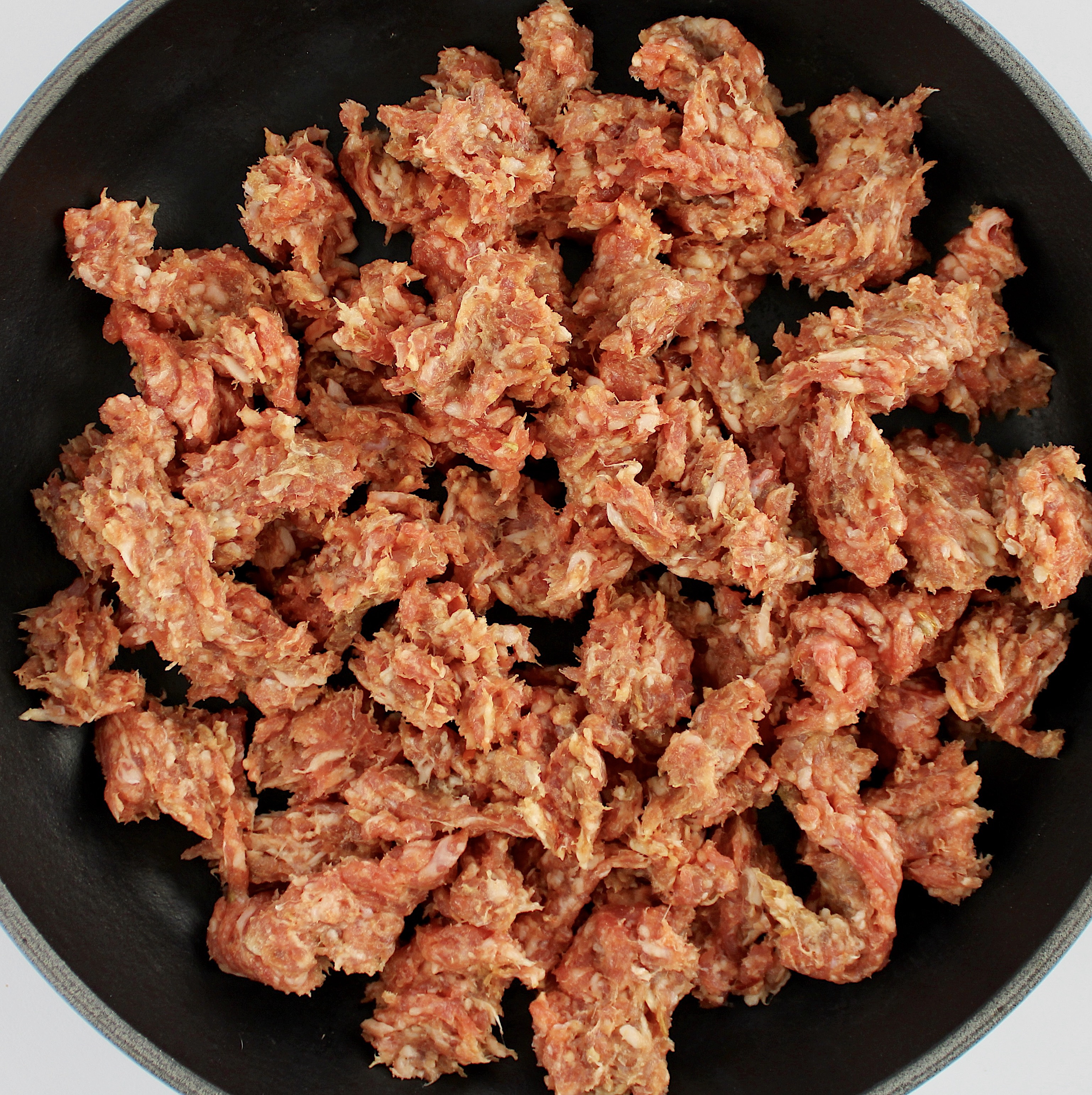 ground sausage in skillet uncooked