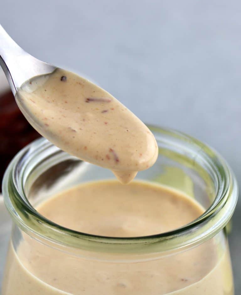 Chipotle Aioli being spooned out of open glass jar