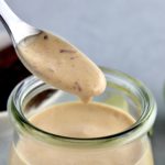 Chipotle Aioli being spooned out of open glass jar