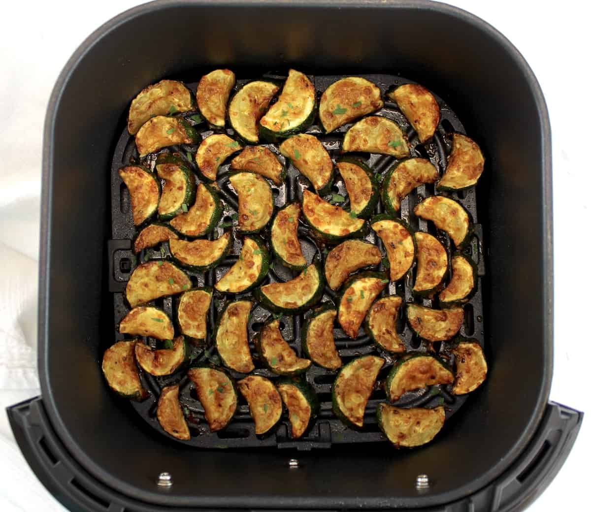Air Fryer Zucchini in air fryer basket cooked