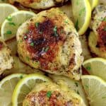 closeup of Baked Chicken Thighs with lemon slices