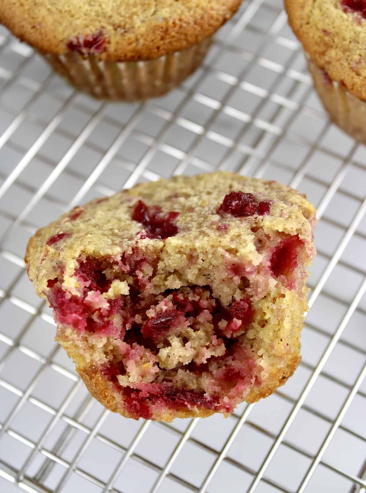 Cranberry Sauce and Walnut Muffin on cooling rack with bite missing
