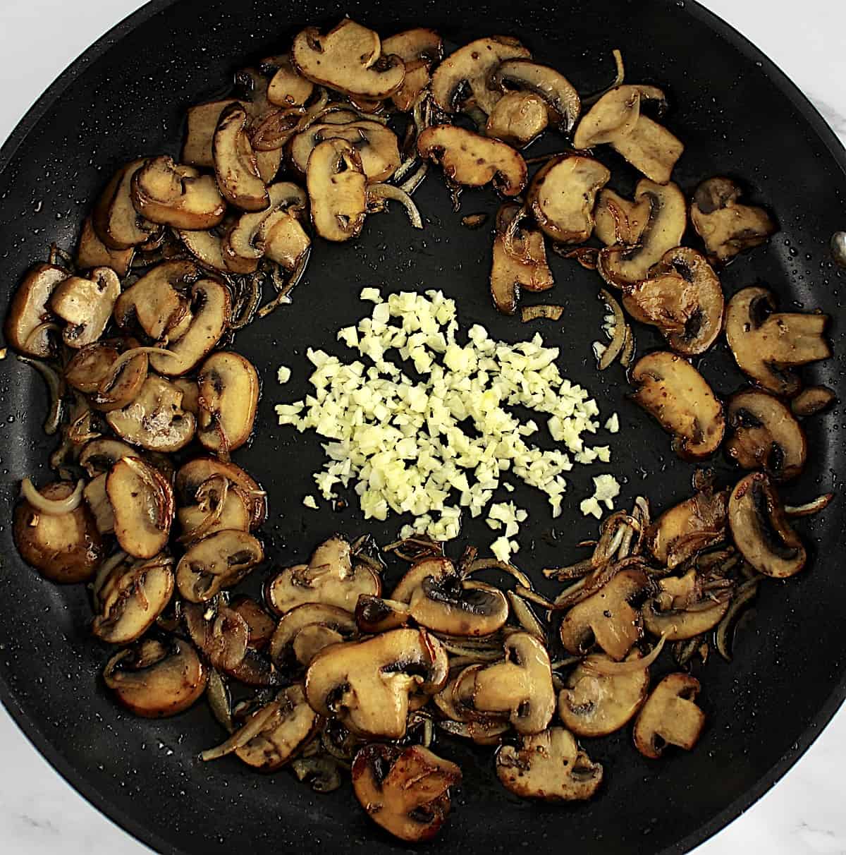sauteed mushrooms, shallots and garlic in skillet