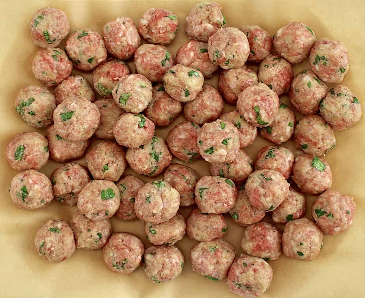 Italian Wedding Soup meatballs on sheet of parchment paper