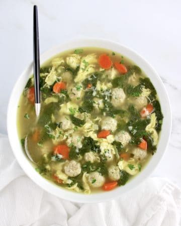overhead view of Italian Wedding Soup in bowl with spoon