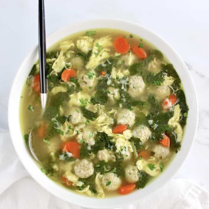 overhead view of Italian Wedding Soup in bowl with spoon