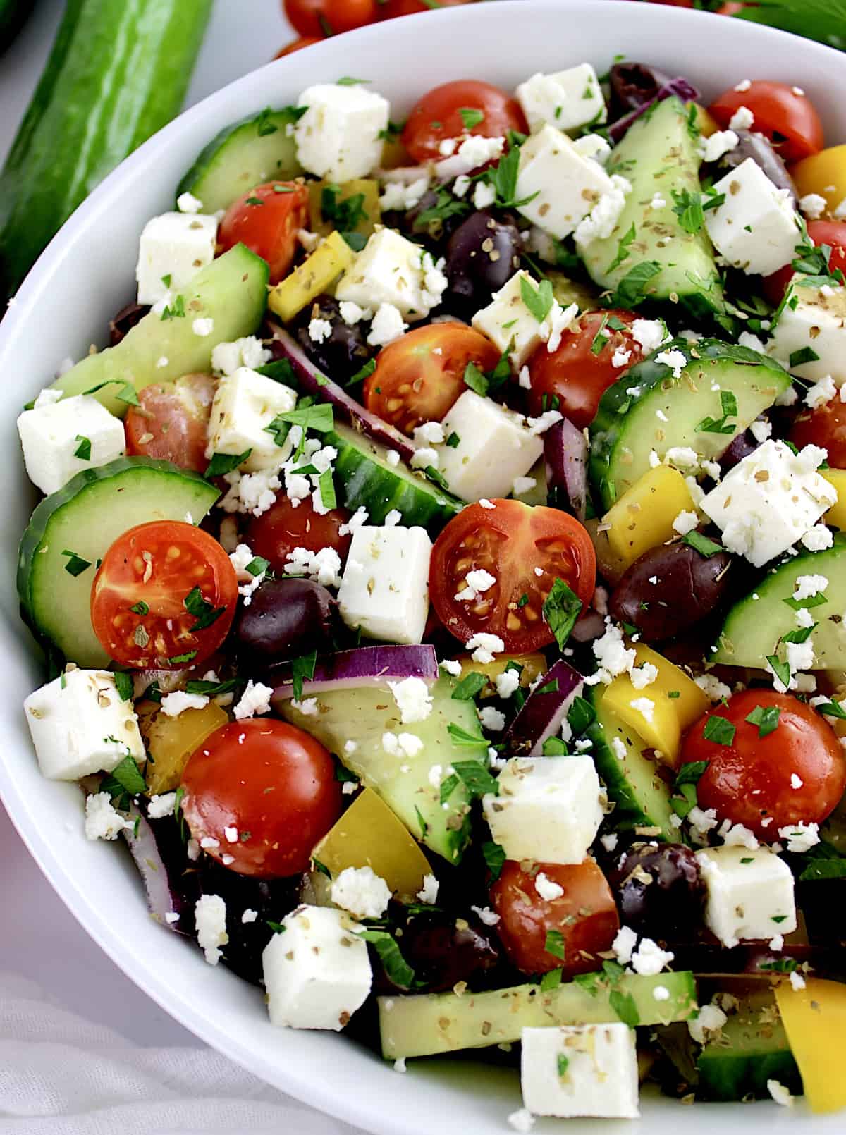 overhead view of Keto Greek Salad with Dressing in white bowl