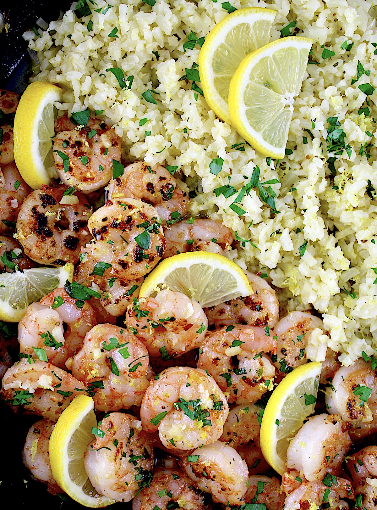 closeup of Shrimp Scampi with Cauliflower Rice with lemon slices in skillet