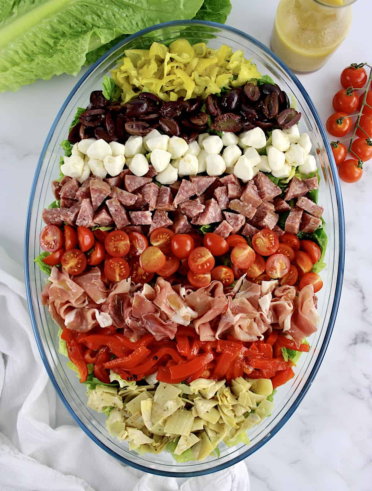 Antipasto Salad with ingredients arranged in horizontal rows