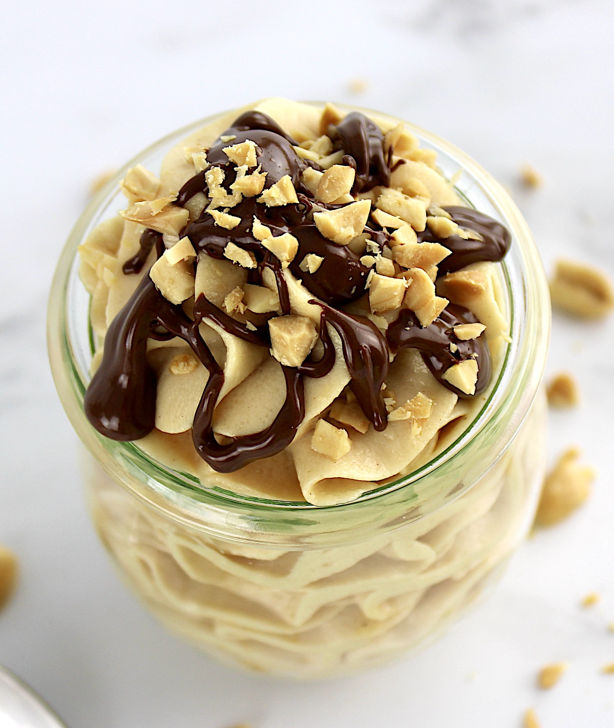 overhead view of Peanut Butter Mousse with melted chocolate and peanuts on top
