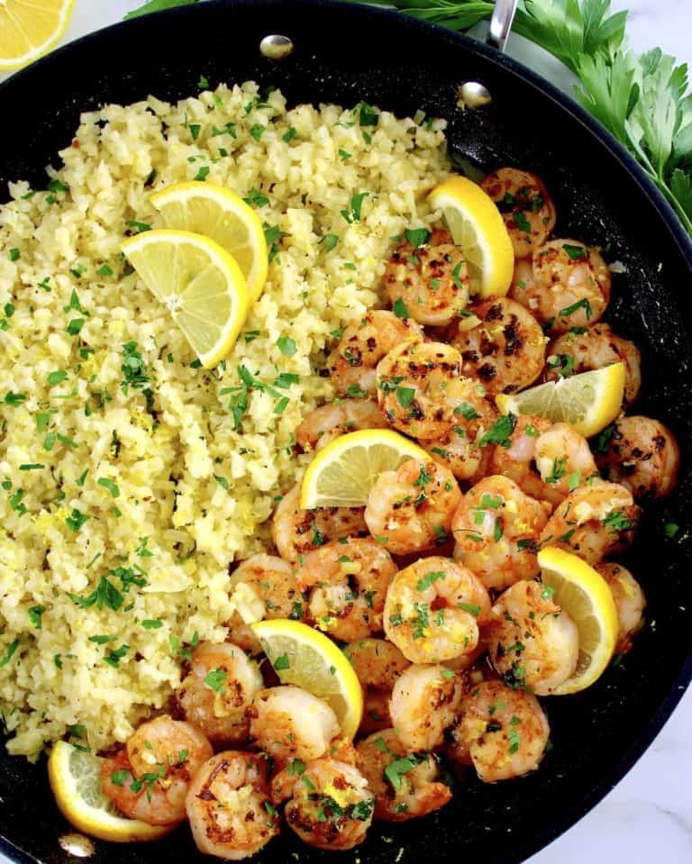 Shrimp Scampi with Cauliflower Rice in skillet with lemon slices